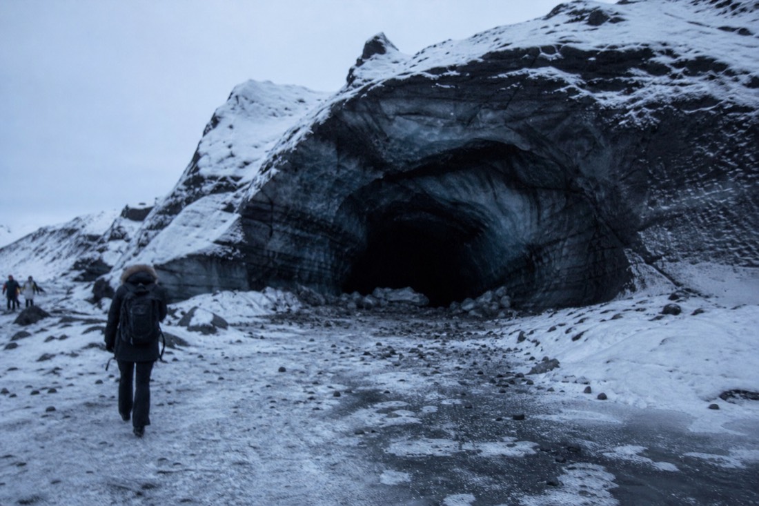 The ash-layered entrance of the Katla ice cave on a South Coast and ice cave tour from Reykjavík