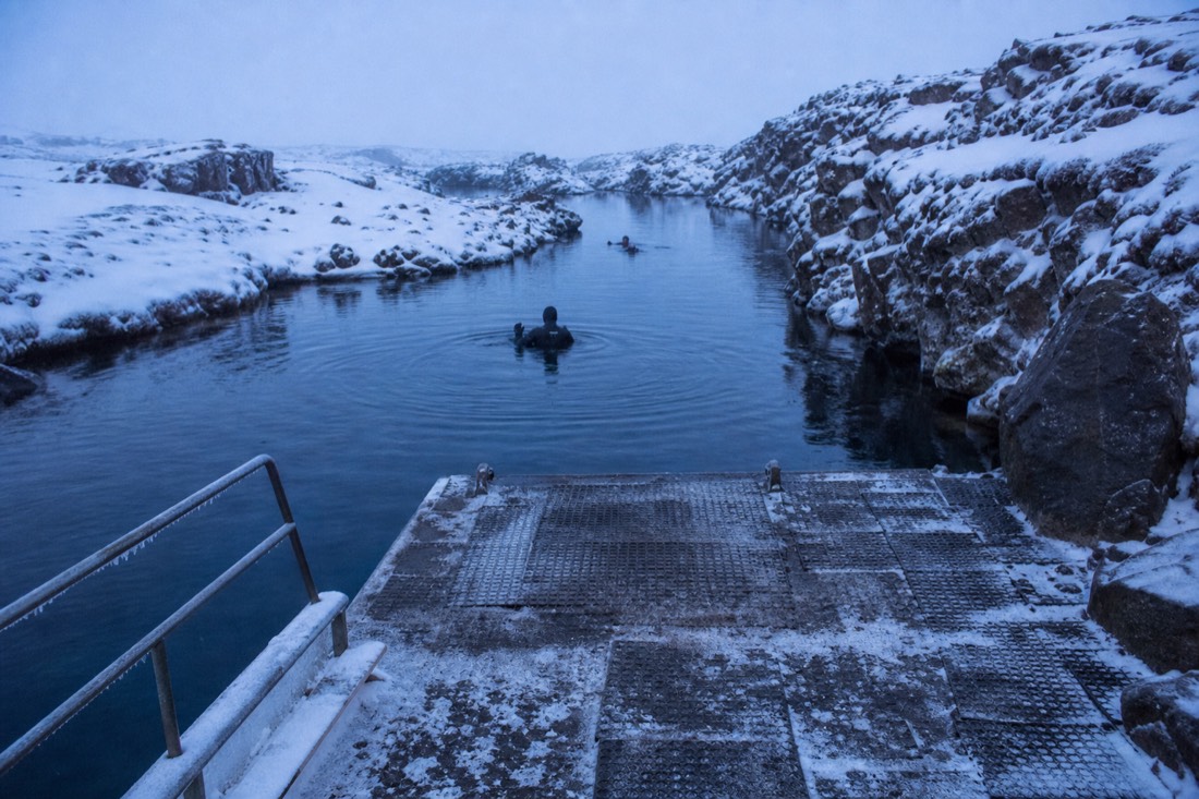 The snow-edged entry platform at the Silfra fissure on a winter snorkelling tour