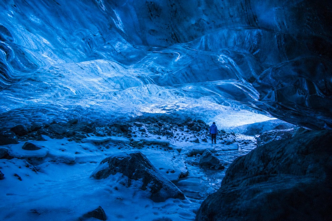 The blue interior of a natural Vatnajökull ice cave on a winter ice cave tour