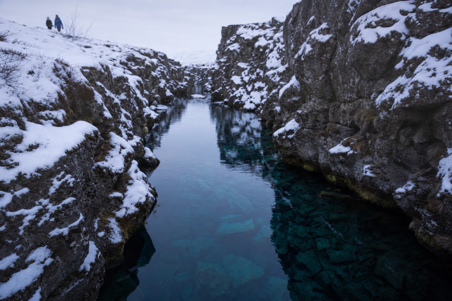 Looking down the clear blue Silfra fissure between two continental plates at Þingvellir